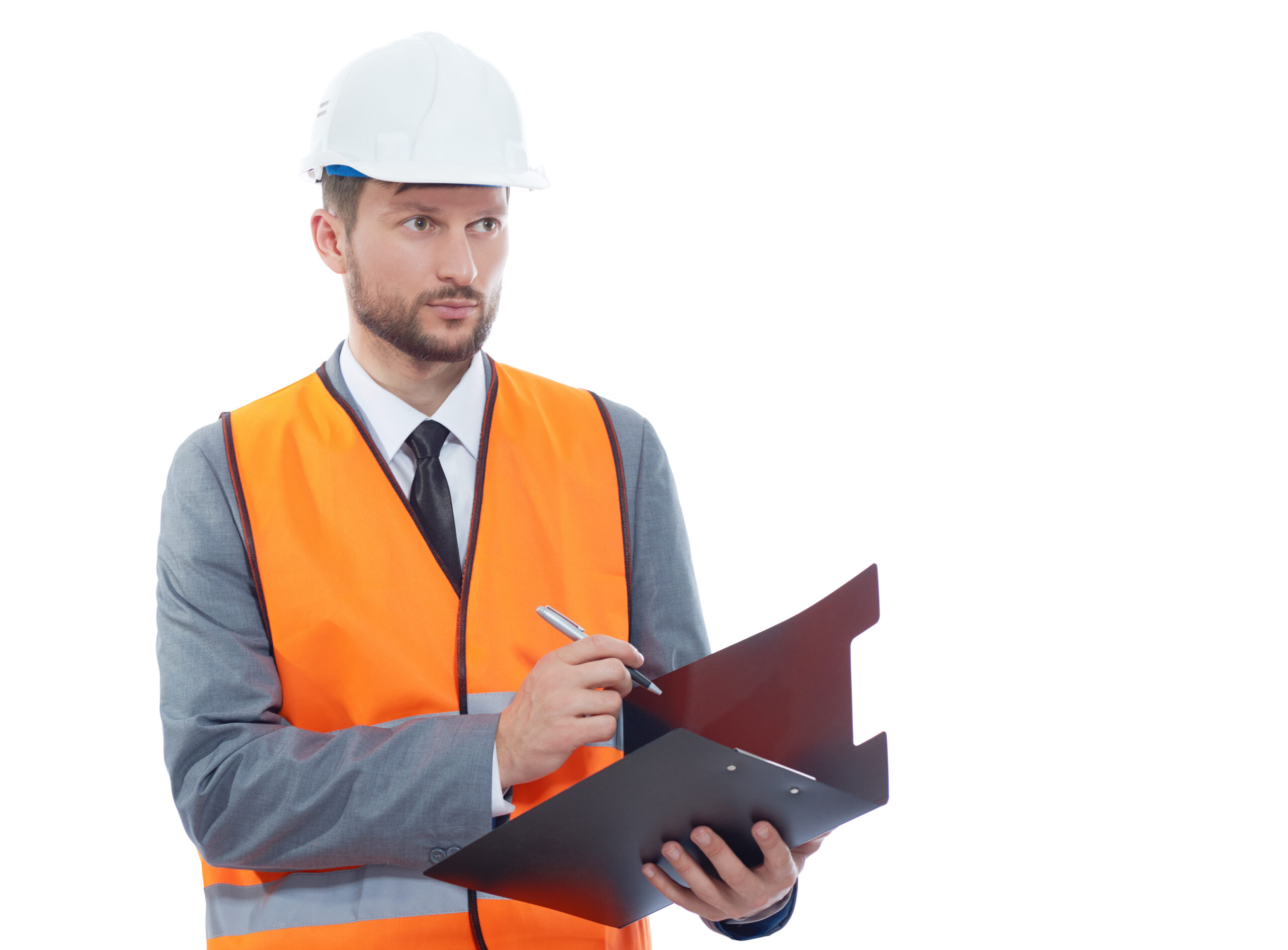 Confident constructionist. Confident male constructionist looking away while making notes on his clipboard copyspace isolated hardhat safety vest wearing occupation building project architectural